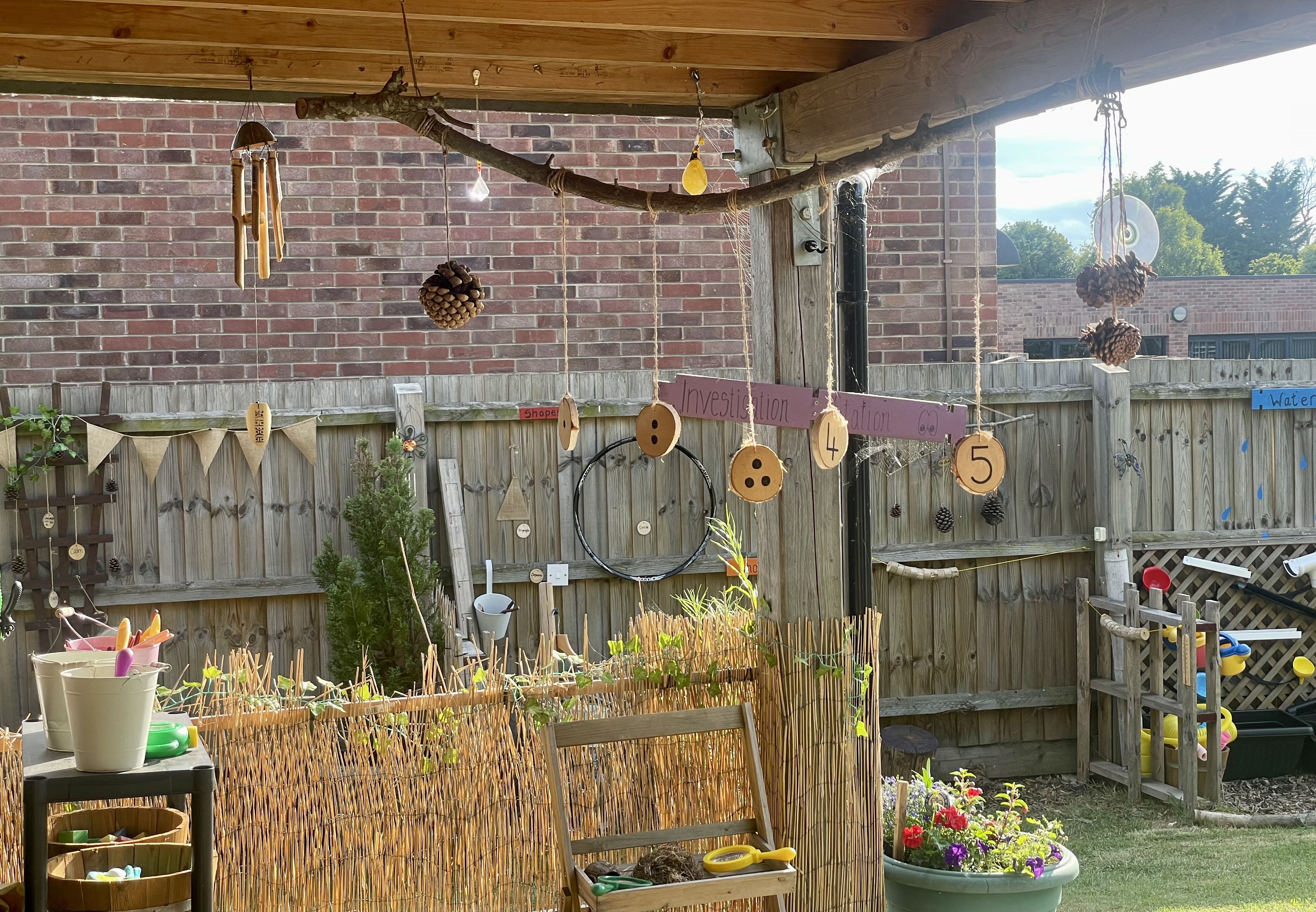 Photo of a garden with lots of homemade wind chimes