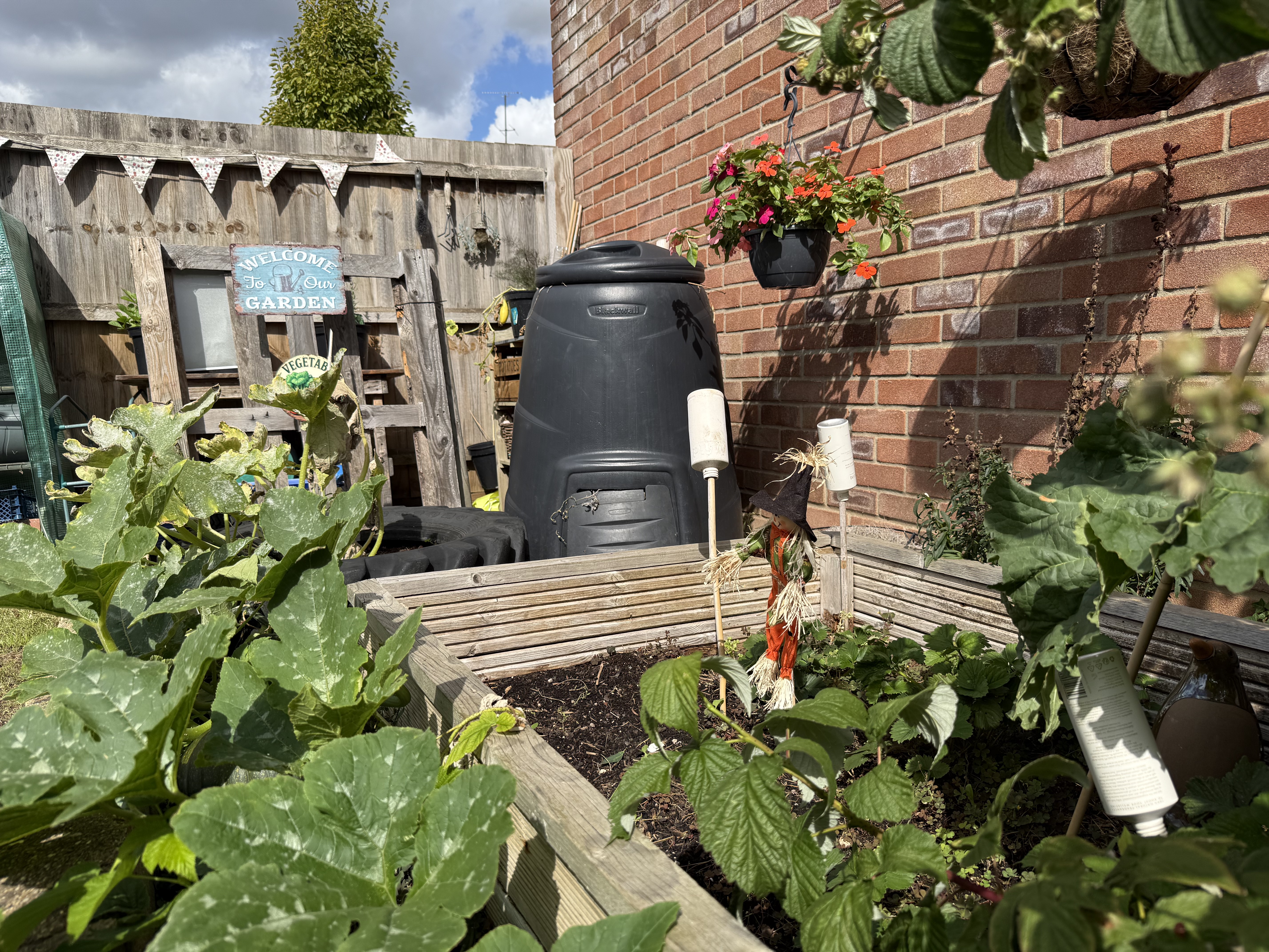 Preschool garden including scarecrow and signage