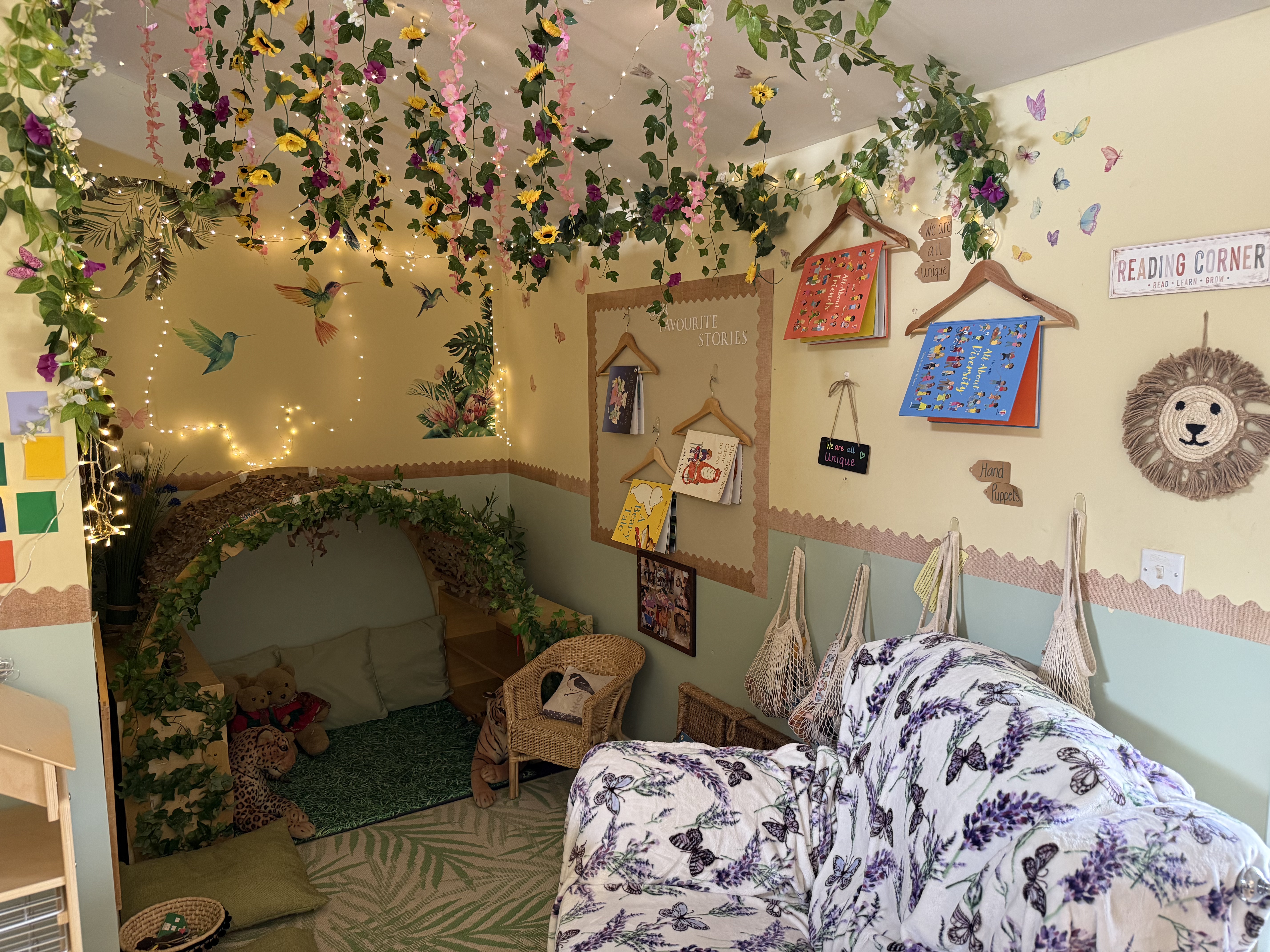 Photo of preschool reading corner with chair and many cushions.