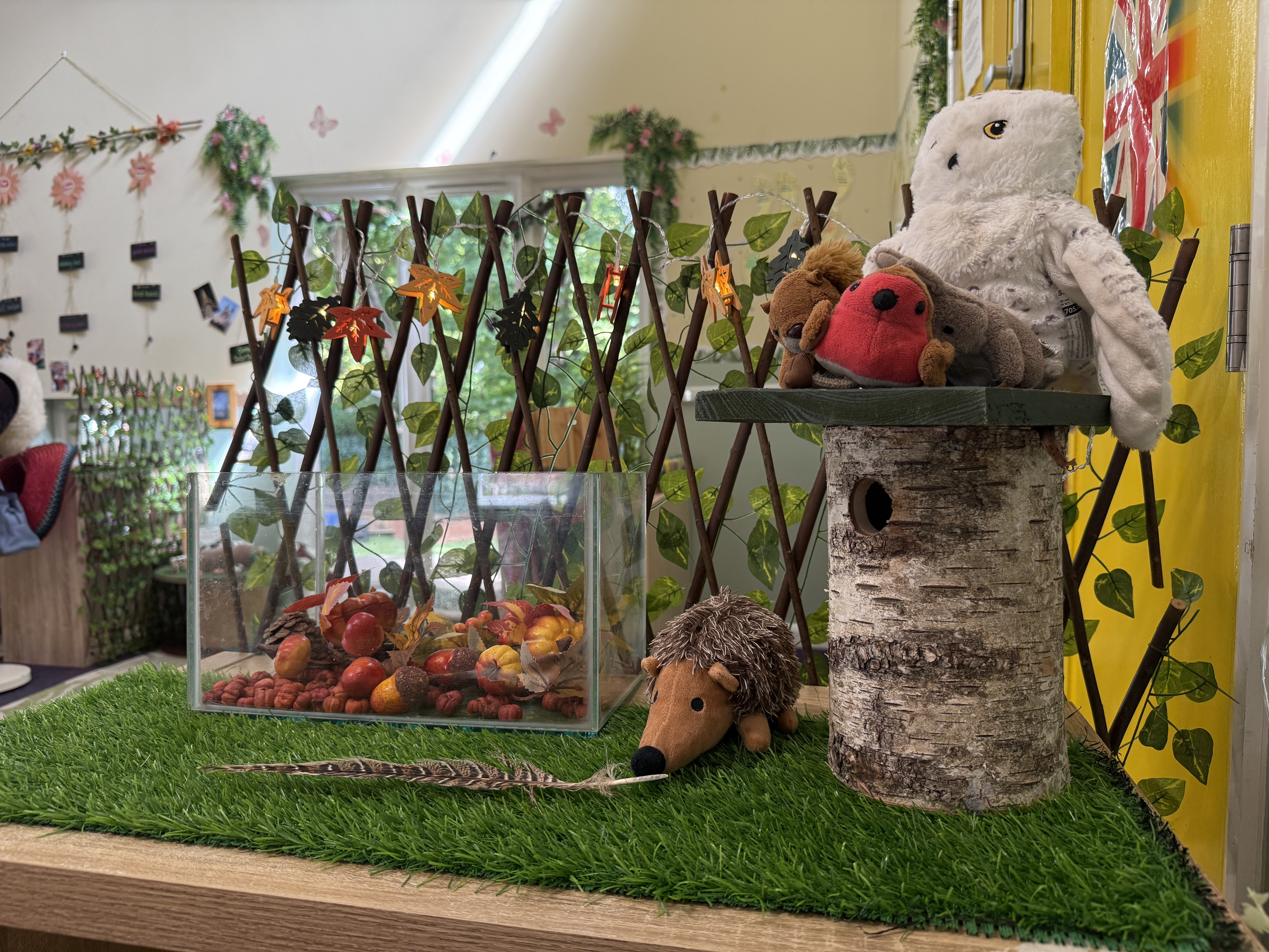 Display being ready for autumn including conkers and stuffed hedghog
